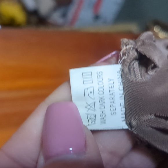 J. JANET* fun funky asymmetrical 'hole-y' vest in a neutral taupe colour - Picture 10 of 10